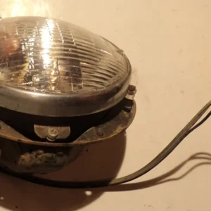 1957 Mercuryheadlight potleft Utförsäljning