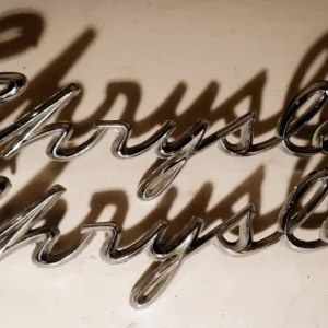 1959Chrysleremblem (a bracket is off, see picture) (pair) Fynd