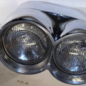 1959Chrysler Imperial headlight pot + headlight door left (A little pores in the chrome) Begränsad tid